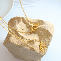 Eclair Golden Knot Necklace